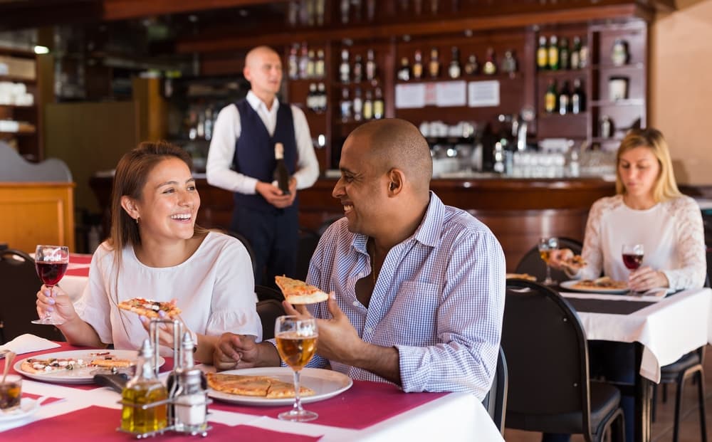Restaurant floor with guests and staff